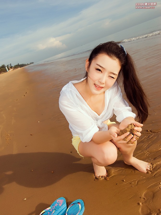 Cute Chinese girl, sexy on the beach.