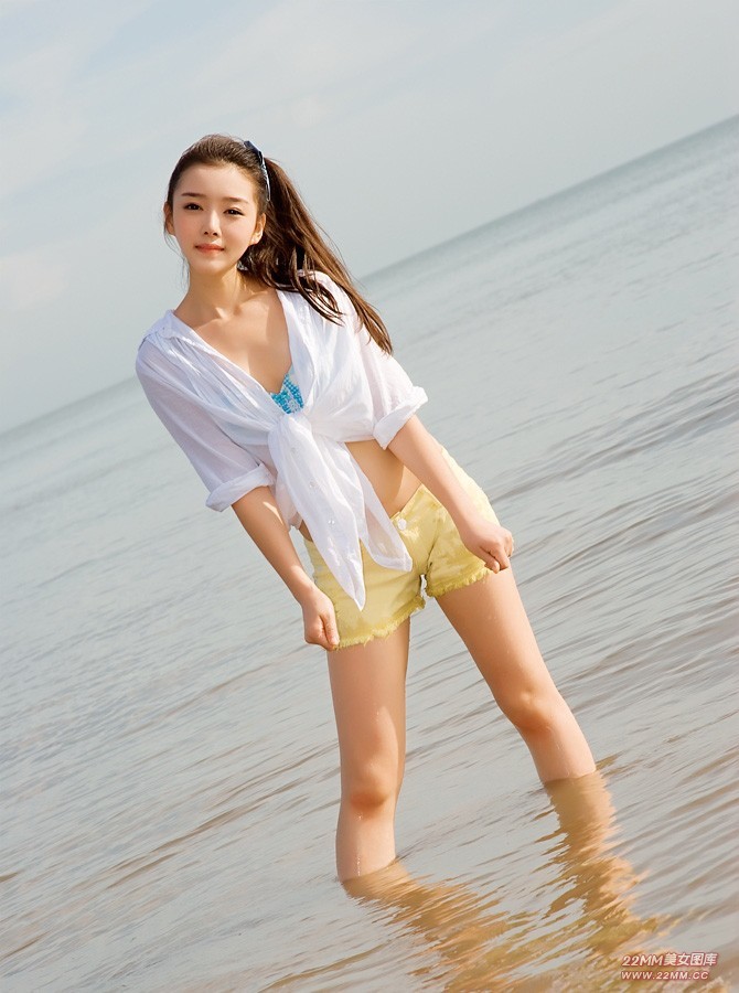 Cute Chinese girl, sexy on the beach.