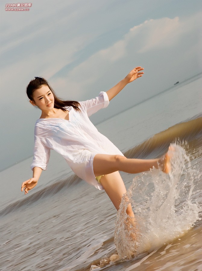 Cute Chinese girl, sexy on the beach.