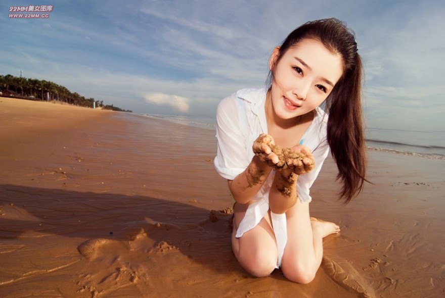 Cute Chinese girl, sexy on the beach.