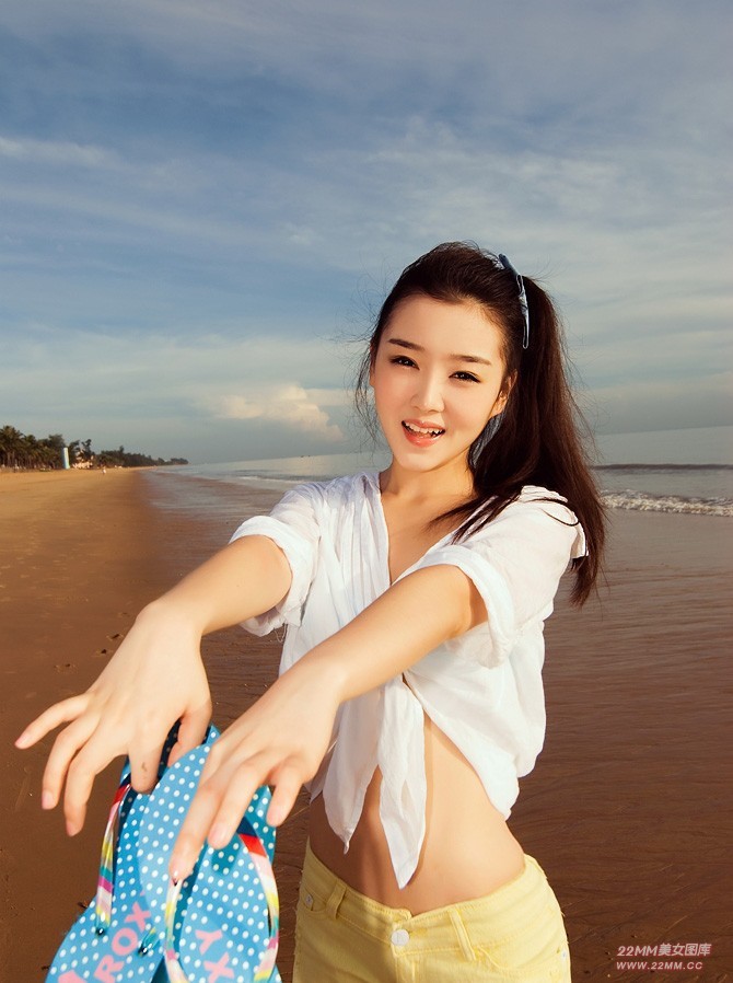 Cute Chinese girl, sexy on the beach.