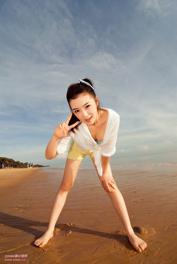 Cute Chinese girl, sexy on the beach.