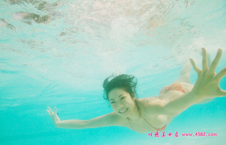 Pretty Chinese lady in swimming pool with XL big size