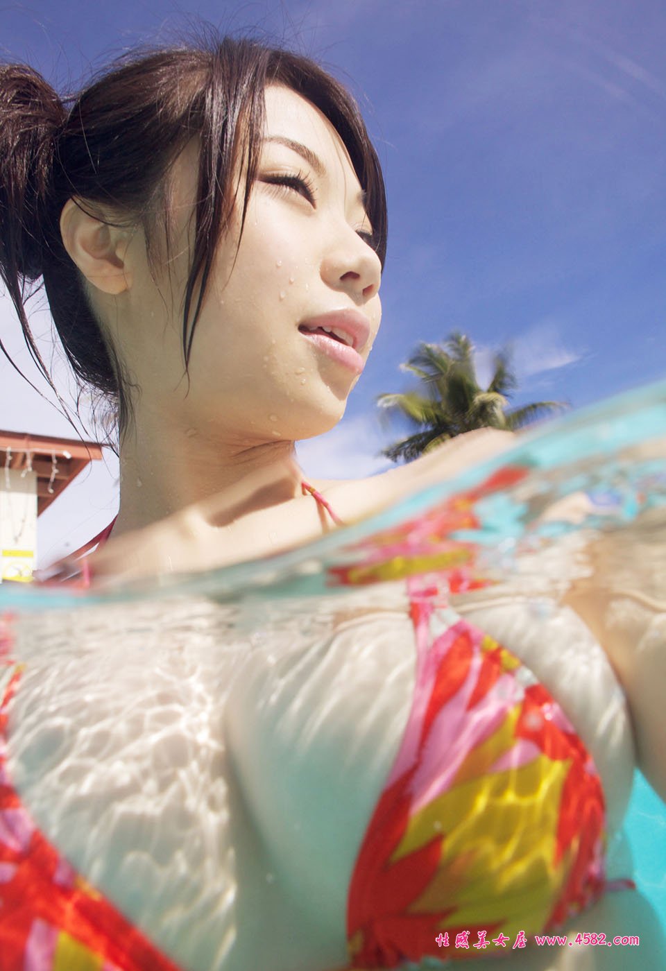 Pretty Chinese lady in swimming pool with XL big size