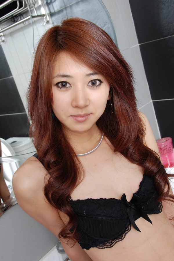 Beautiful Asian lady. Sexy with black underware. She has big eyes.