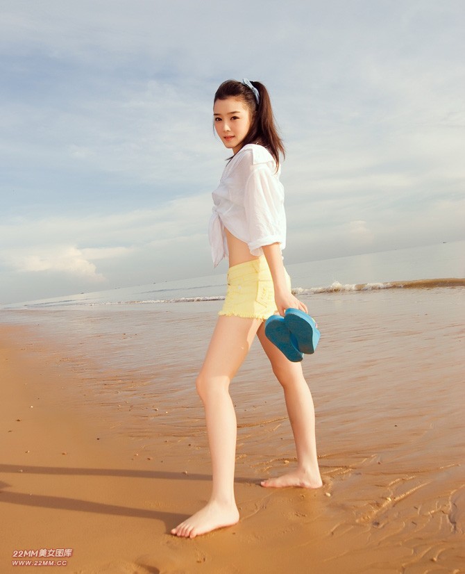 Cute Chinese girl, sexy on the beach.