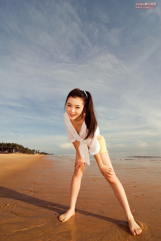 Cute Chinese girl, sexy on the beach.