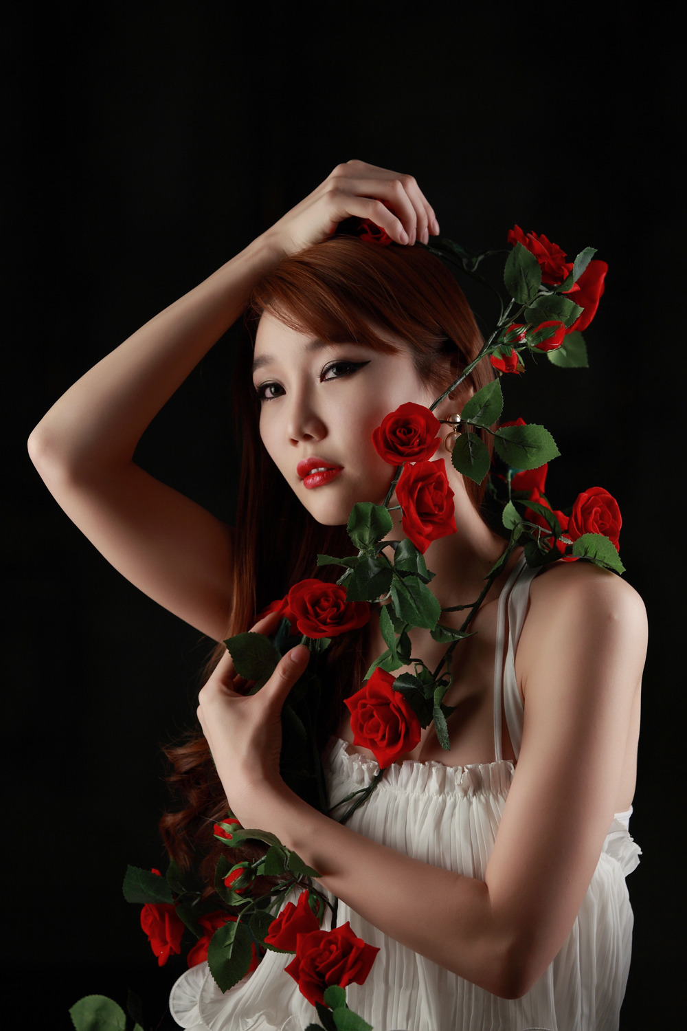 Go Jung Ah Korean lady in white maxi and red roses.